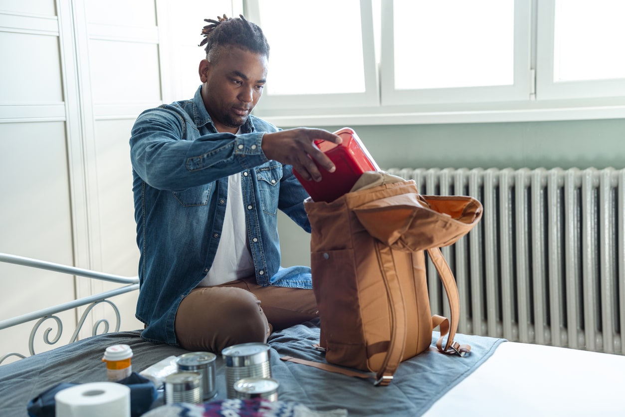 Photo of Expat Packing Emergency Go-Bag for Disaster Preparedness