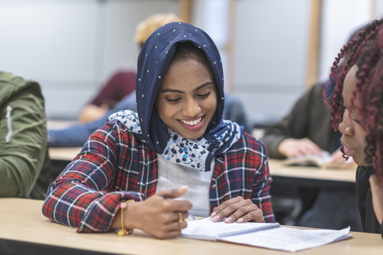 International student studying on campus, representing 2025 U.S. student visa rule changes and tax residency implications.